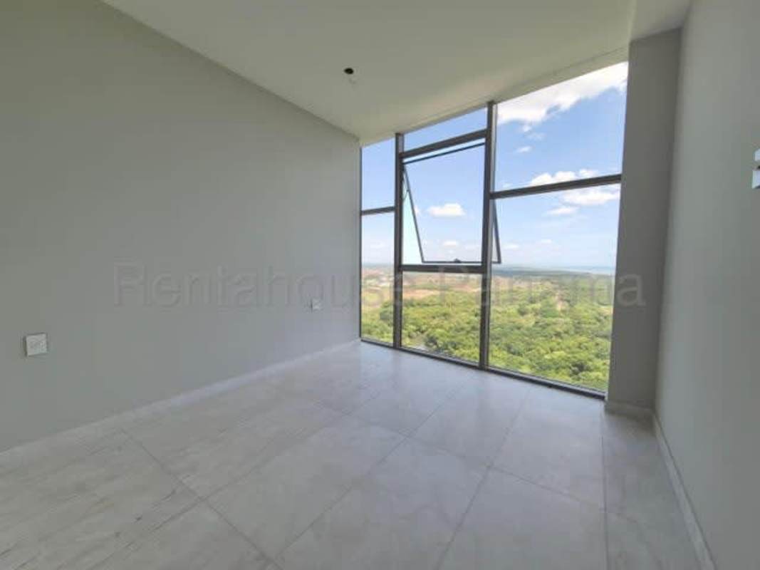 Heated indoor swimming pool with seating areas and luxury finishes in La Maison by Fendi Panama