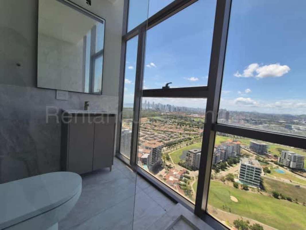 Large balcony with panoramic golf course and ocean views at La Maison by Fendi Panama