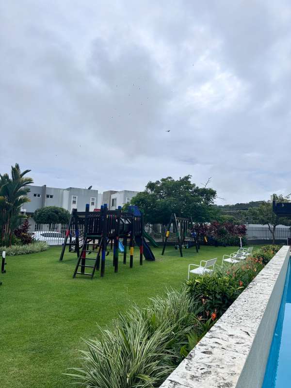 Outdoor green area with playground in gated community Brisas del Golf Panama