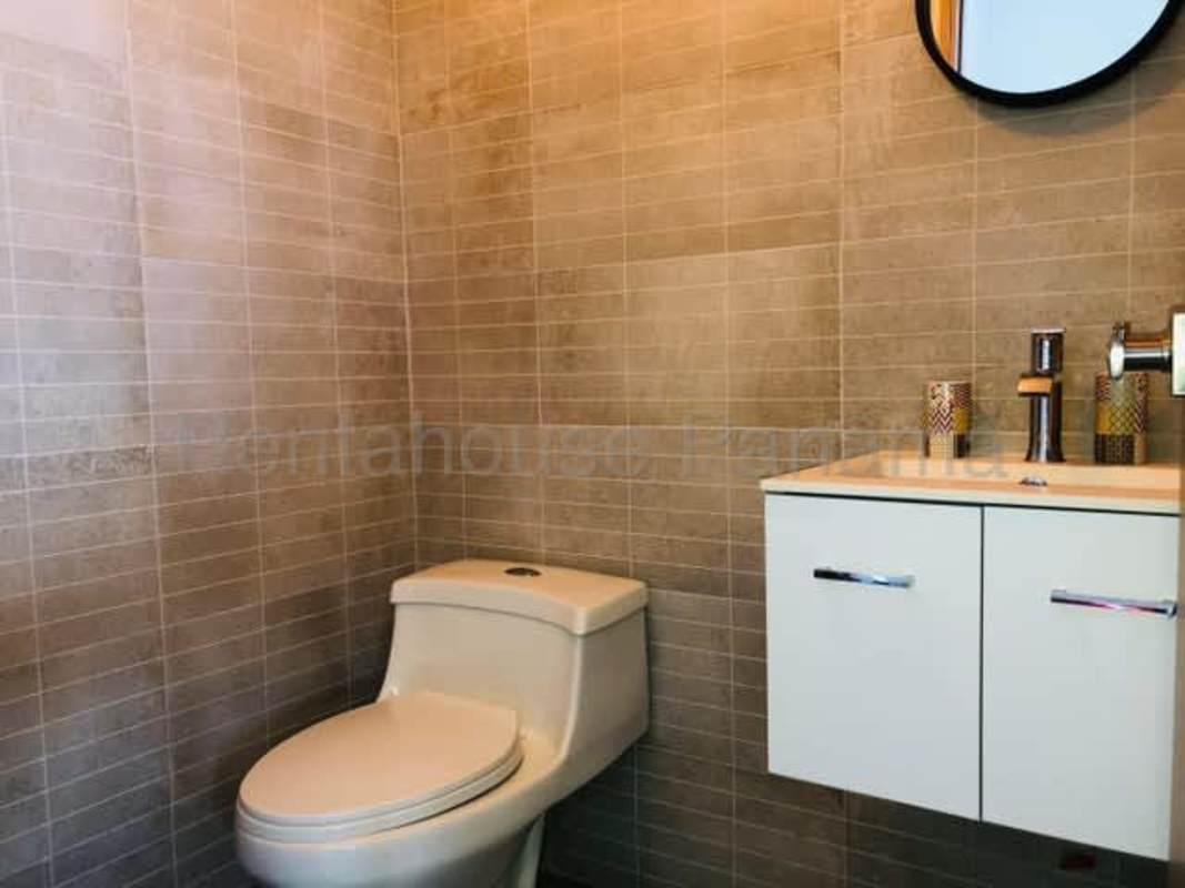Modern bathroom with vanity and shower in apartment PH Loma Vista Tower Panama City