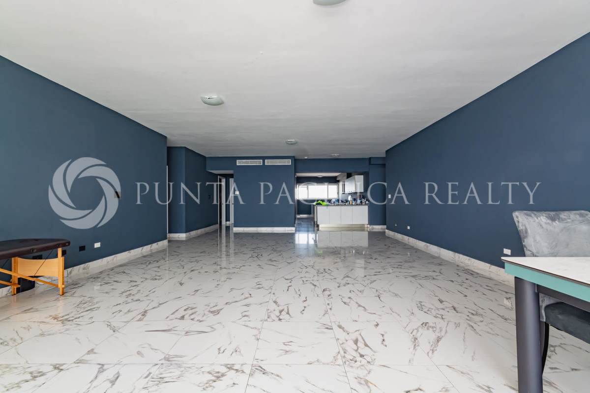 Living room with marble floors, large glass windows and Pacific Ocean view in PH Waters On The Bay Panama
