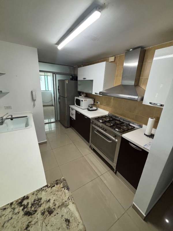 Large master bedroom with built-in closet and window view in Altos de Golf apartment Panama