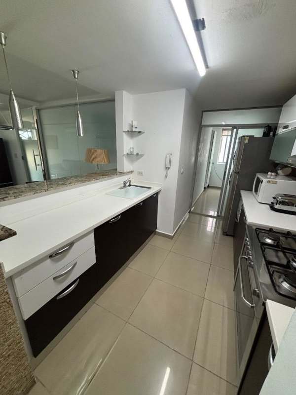 Modern bathroom with glass pedestal sink and walk-in shower in Altos de Golf Panama