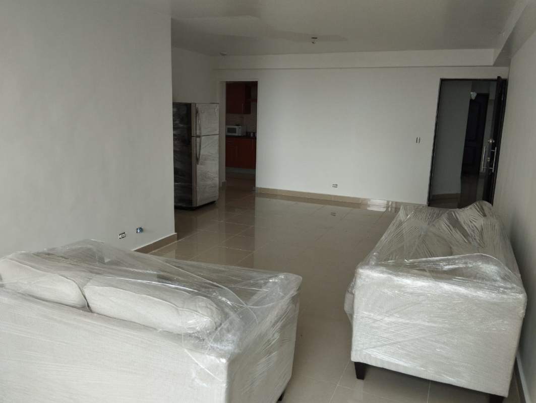 Open floor plan with tiled floors and bright windows in Panama apartment