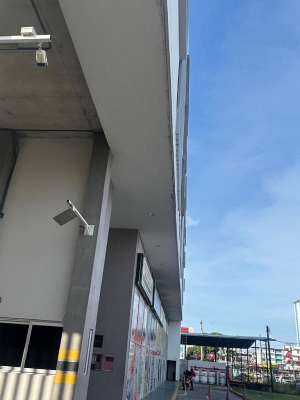 Modern dining space adjacent to kitchen with pendant lighting PH Terramar Panama City