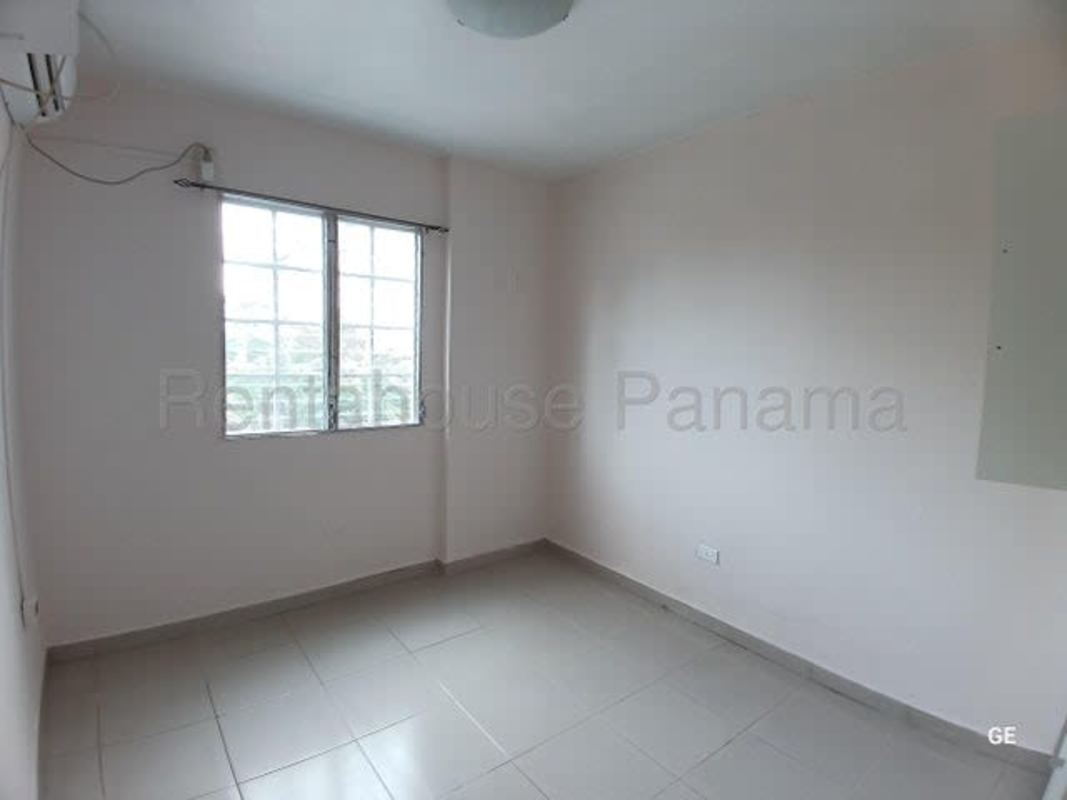 Second bedroom ceramic tile floors, built-in closet, window with city view PH Parque Lefevre Panama City