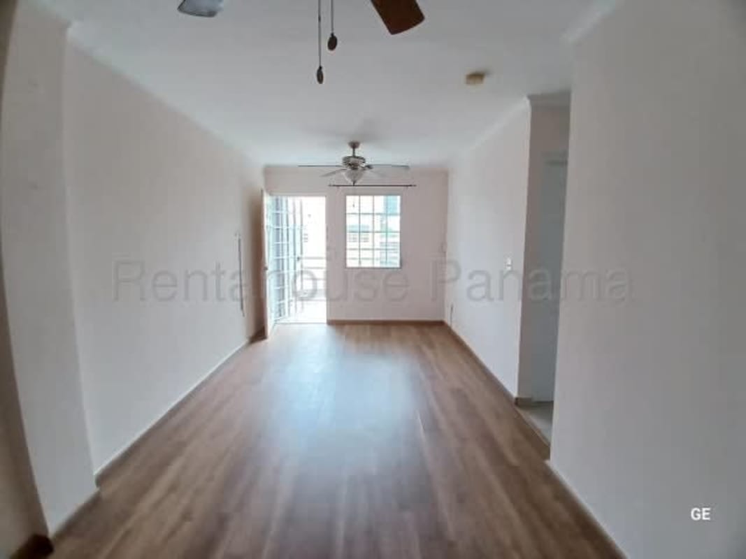 Empty bedroom with large window, tiled floor in PH Parque Lefevre affordable apartment Panama City