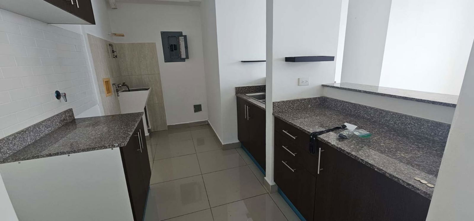 Contemporary kitchen with granite counters and breakfast bar in PH Park City Bella Vista Panama
