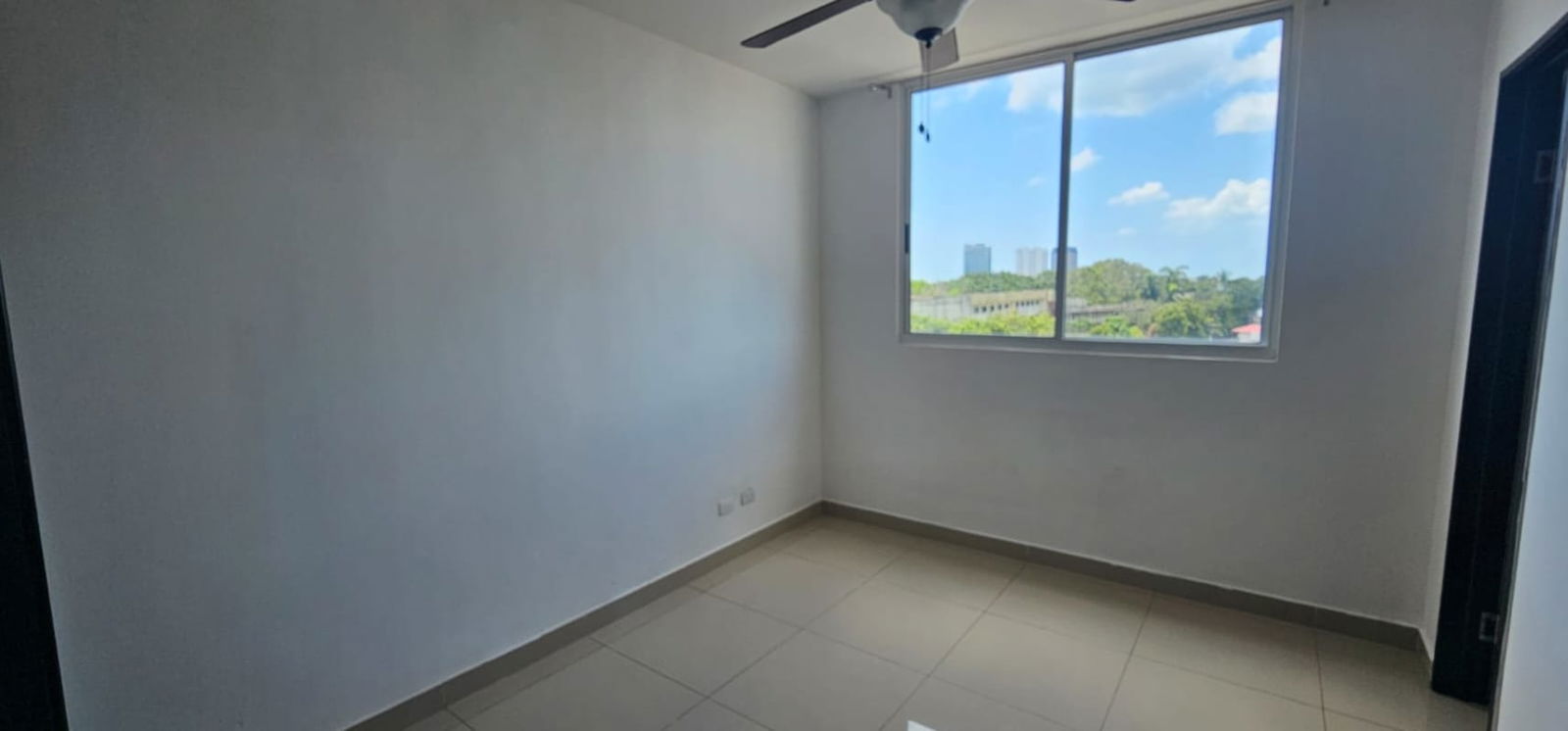 Bright bedroom featuring tiled floor and large windows in Park City Bella Vista Panama