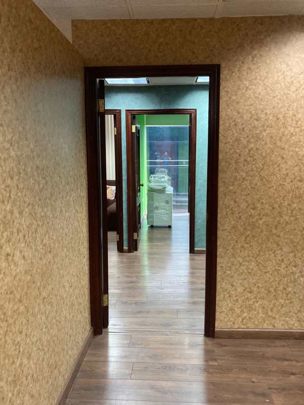 Modern private office space with wooden laminate flooring and city views in Plaza Obarrio Panama