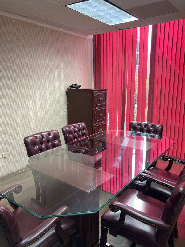 Remodeled bathroom with vessel sink and wood vanity in PH Plaza Obarrio commercial office Panama