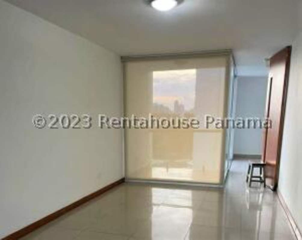 Modern bathroom with double sink, large mirror, and glass shower at PH Bahia del Golf Panama