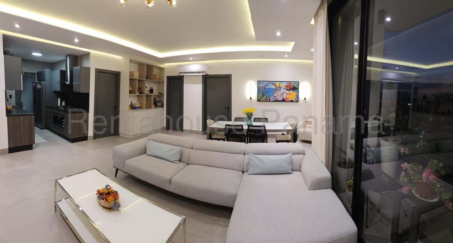 Contemporary living and dining space leading to ocean-view balcony in PH Victory Sport Coco del Mar Panama