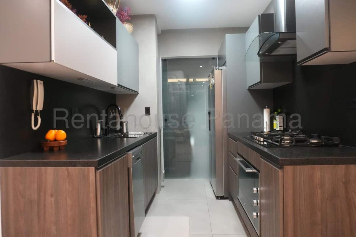 Modern granite kitchen with custom cabinets and appliances in PH Victory Sport apartment Panama
