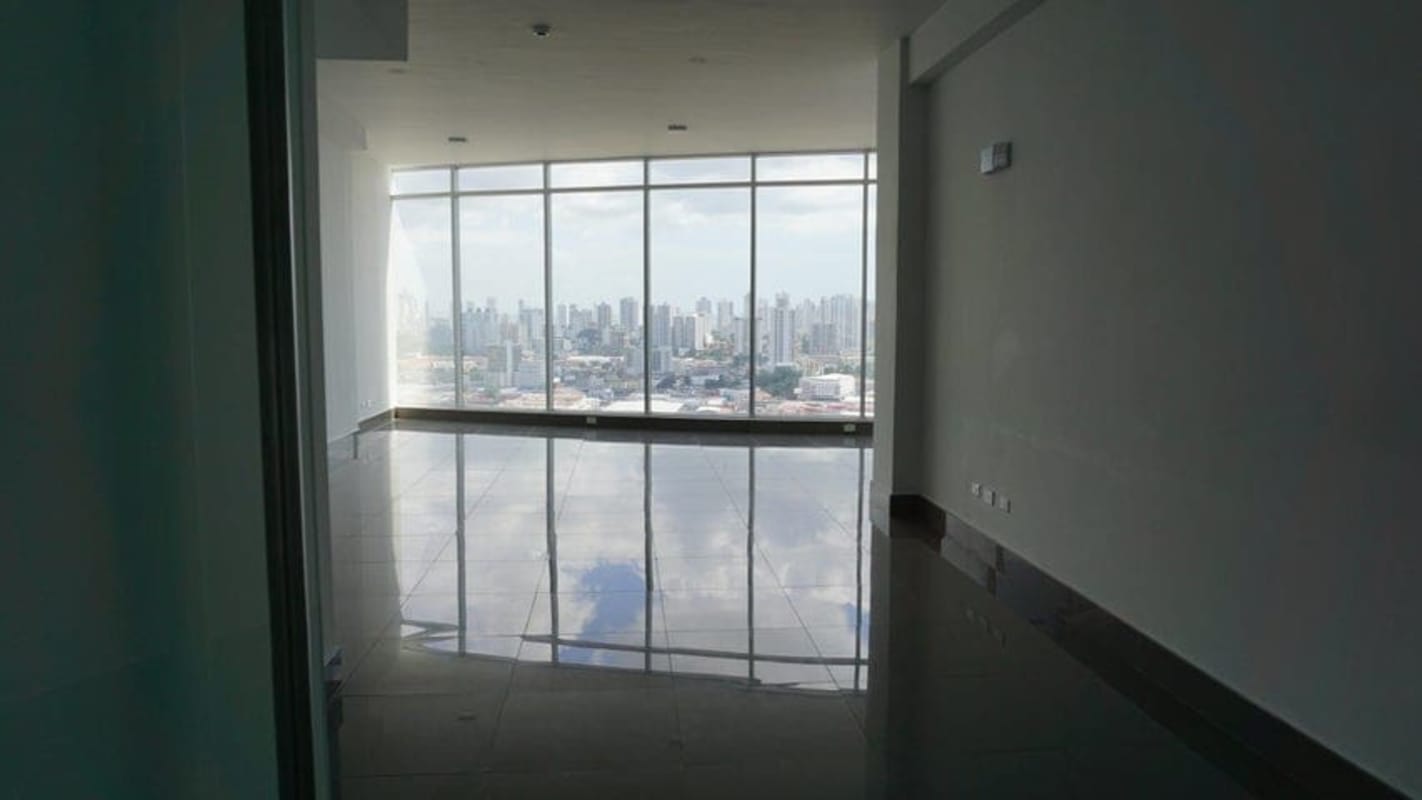 Spacious empty commercial space with white walls and ceramic tile flooring Golden Point El Dorado Panama City