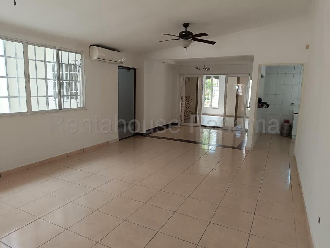 Spacious empty bedroom with tile floor and wardrobe in Brisas del Golf Panama