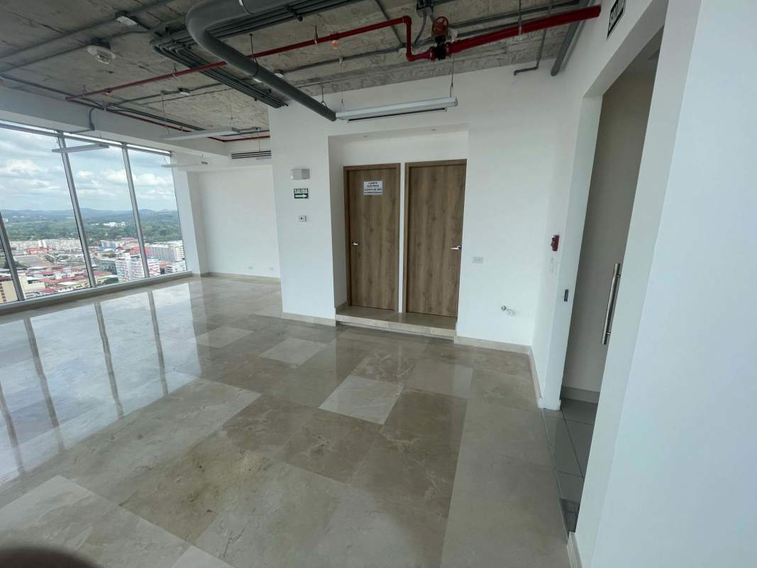 Lobby hallway of PH Balboa Office Center with marble floors and natural light