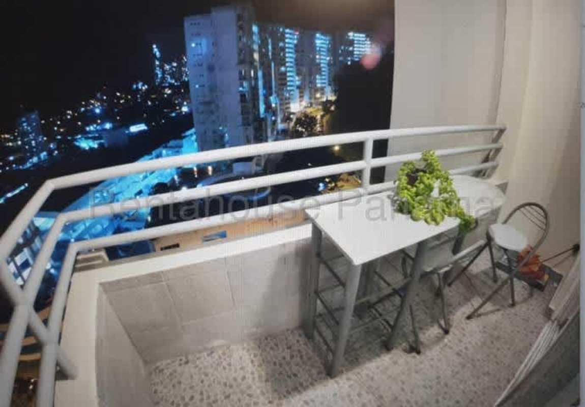 Compact bedroom with built-in wardrobe, TV, plaid bedding PH Majestic Garden Edison Park