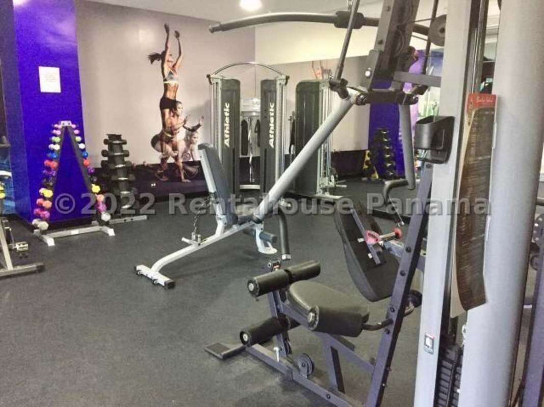 Modern gym with weight racks and machines in PH Park View Carrasquilla Panama City