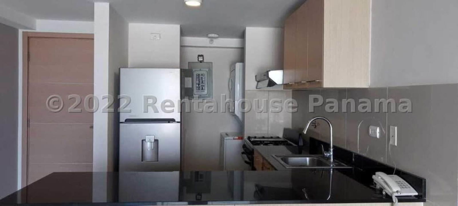Contemporary kitchen with granite style countertops in PH Park View apartment Panama