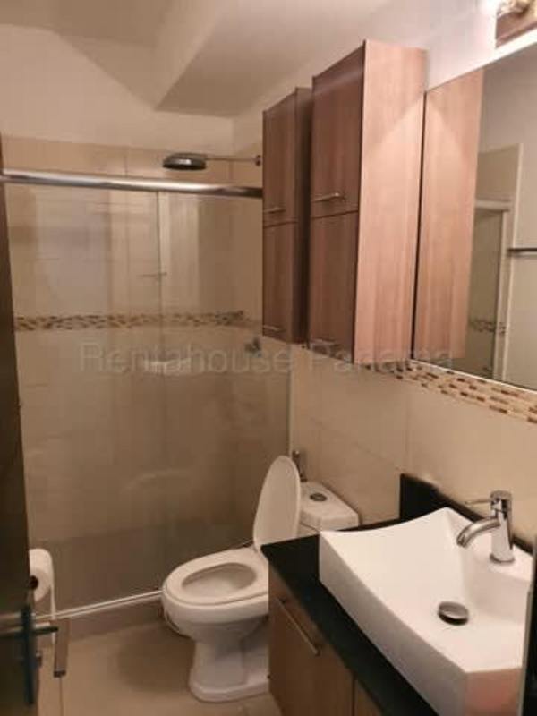 Contemporary bathroom with glass shower, vanity sink and cabinets in PH Diamond Tower Panama City
