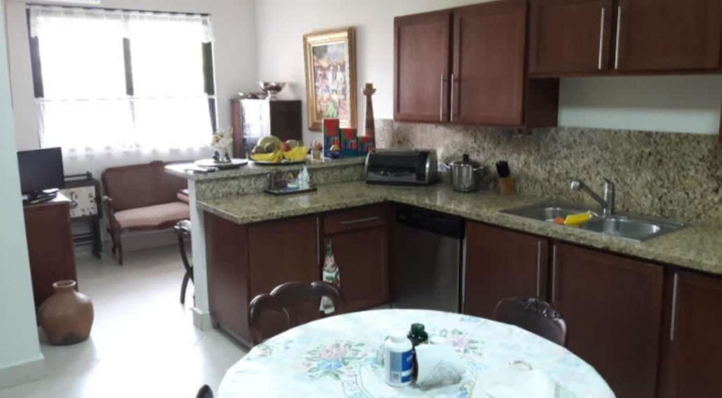 Traditional kitchen with granite counters, wood cabinets, appliances Embassy Club Clayton Panama