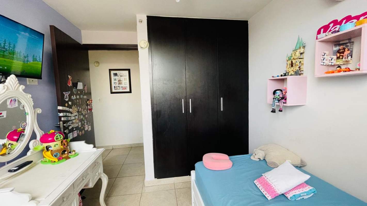 Modern dining room with colorful art and large mirror in PH Carrasquilla Garden Carrasquilla Panama rental apartment