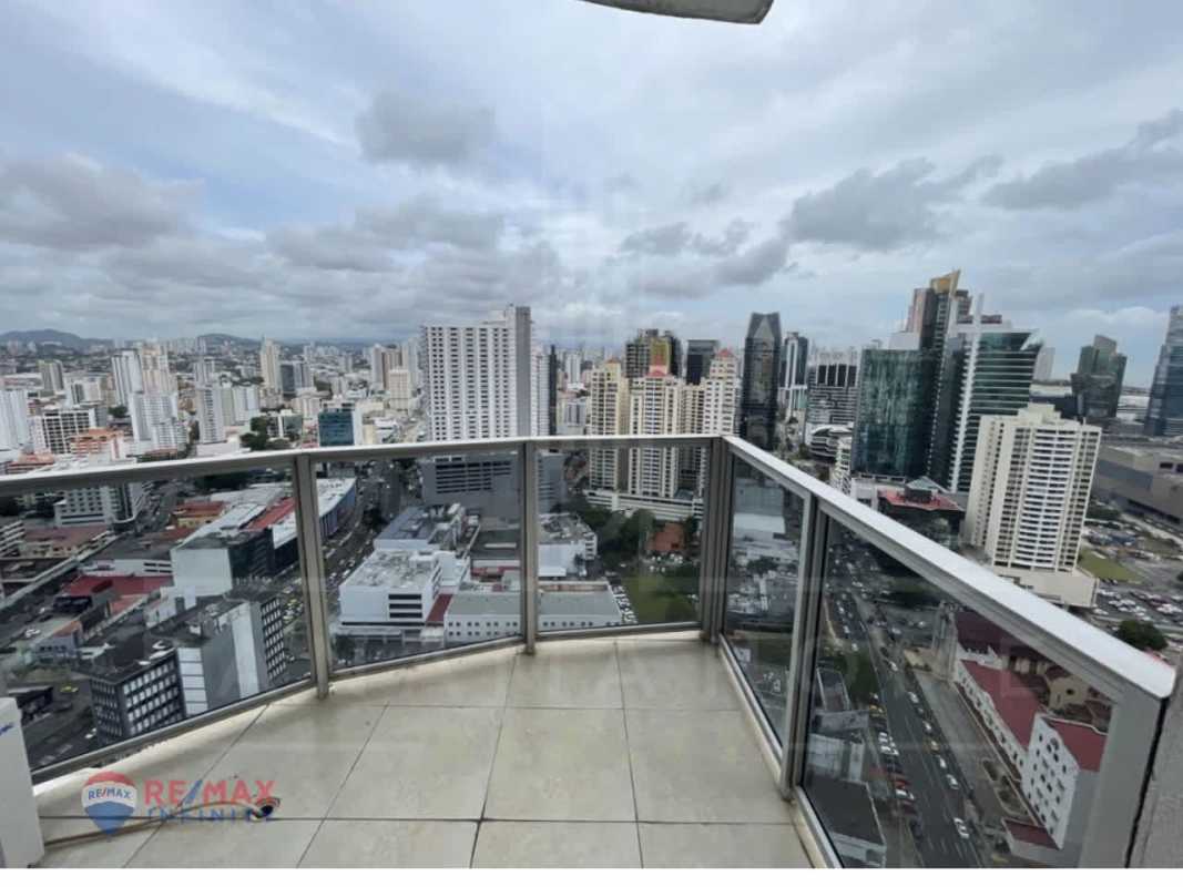 Glass-walled balcony with panoramic urban views at PH Denovo apartment Obarrio Panama