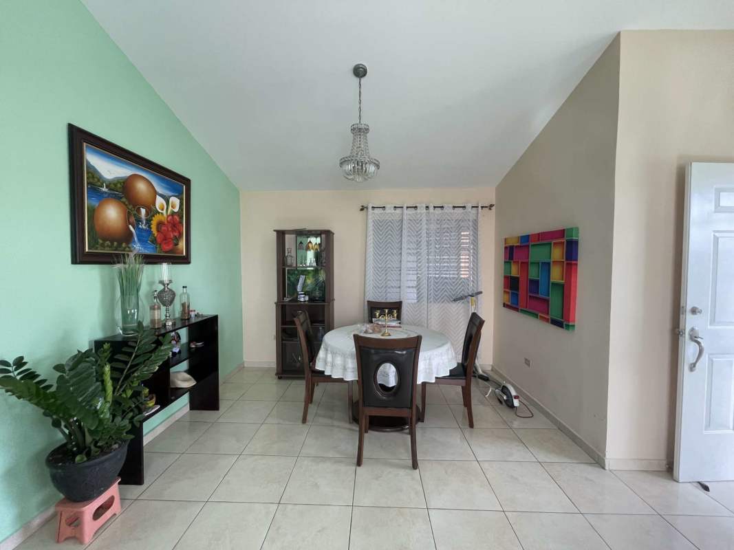 Spacious living area with ceiling fan, tile floor, mint walls at Colinas del Lago Las Cumbres