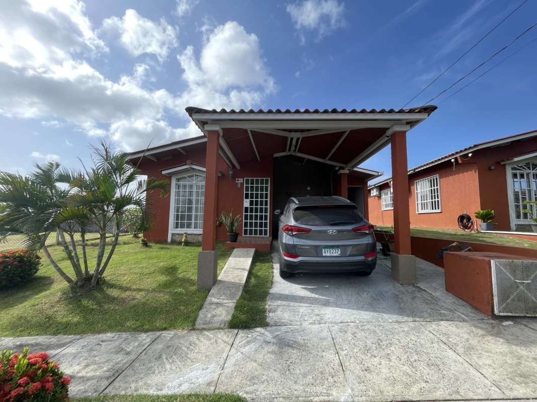 Dining area with mint green wall, hanging chandelier, tile floor, in PH Colinas del Lago Las Cumbres Panama