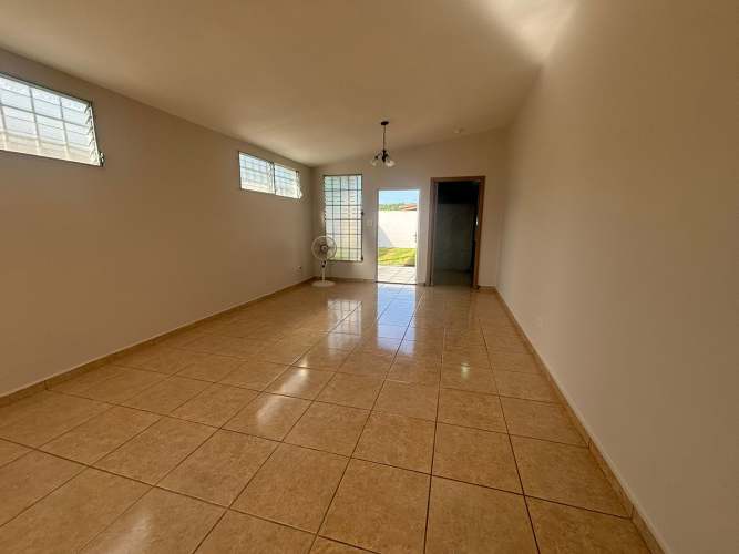Bathroom featuring tiled walls, pedestal sink, glass block window in Golf Gardens Panama City