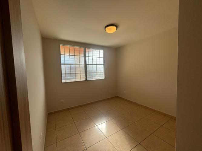 Master bedroom with walk-in closet and tiled flooring in Golf Gardens Brisas del Golf Panama