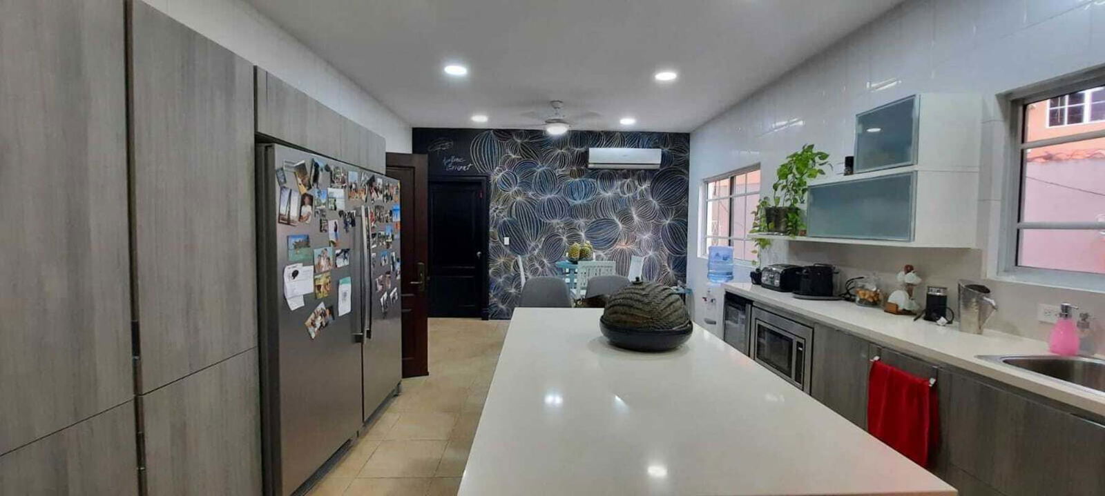 Italian kitchen with marble counters, island, stainless appliances in PH Costa de las Perlas Panama