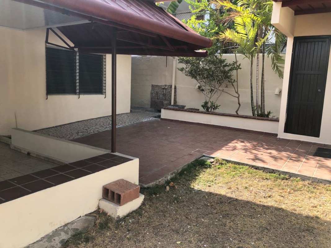Garden patio area with plants, tiled sections, covered outdoor zone in El Dorado Panama City