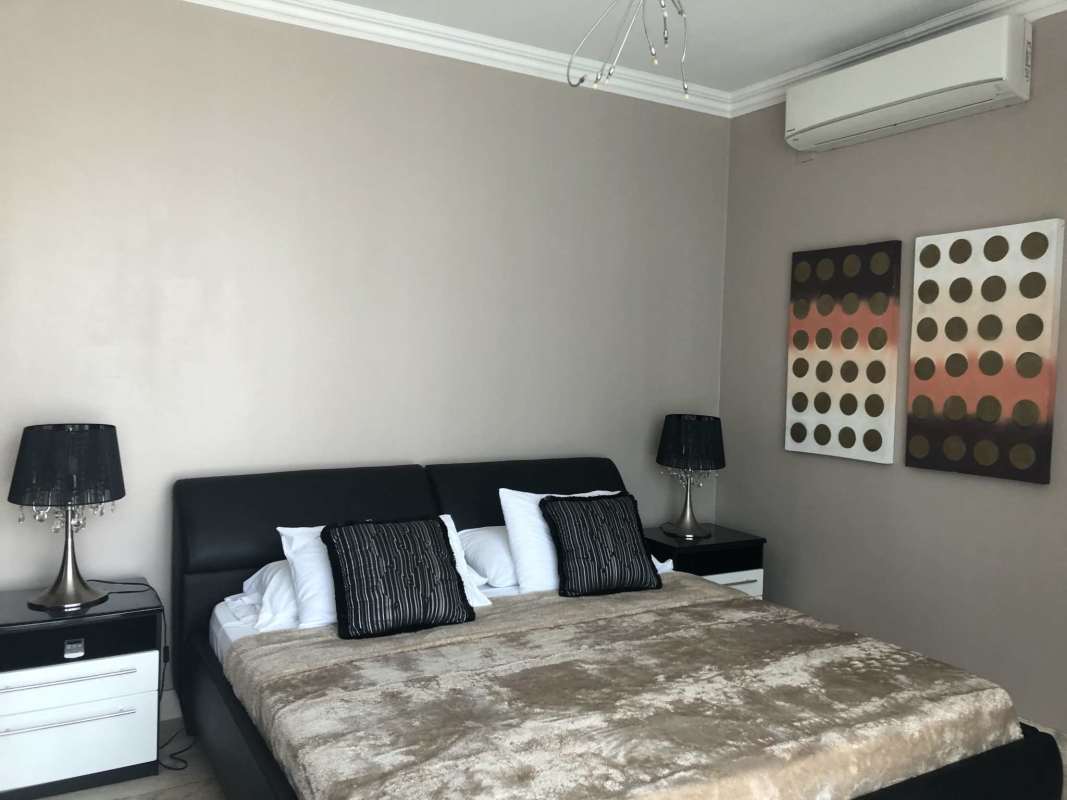 Modern guest bedroom with large windows city views Punta Pacifica Panama