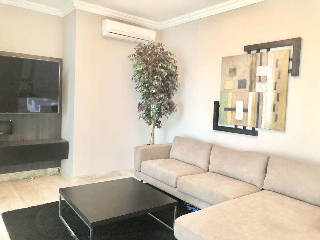 Contemporary living room flat screen TV marble floor air conditioning Punta Pacifica