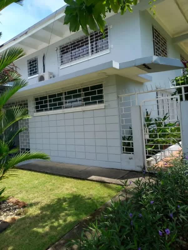 View of a two-story house with large garden for rent in La Boca Balboa Panama
