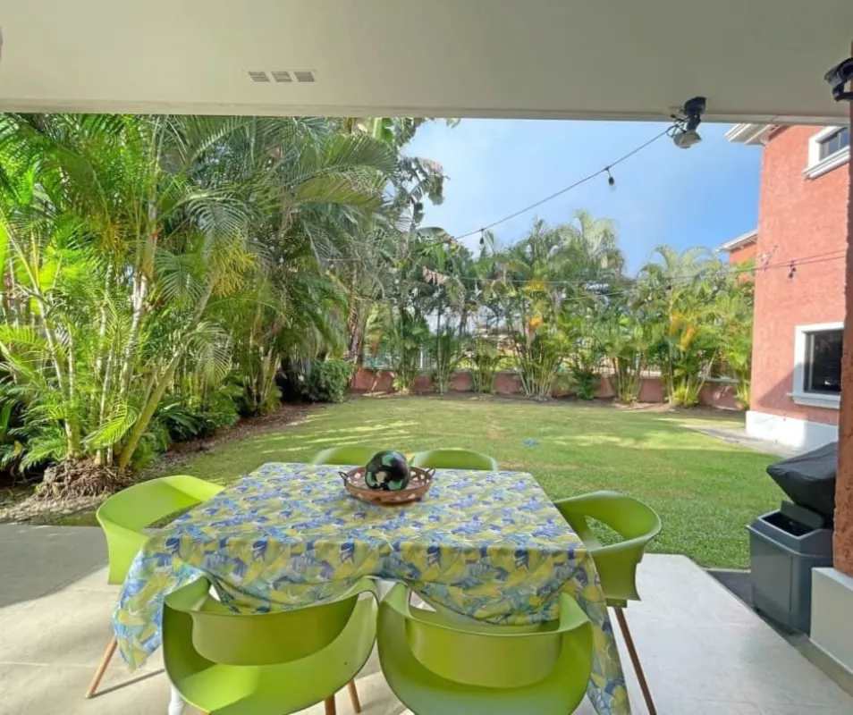 Lush tropical backyard garden with patio Los Lagos Clayton rental house