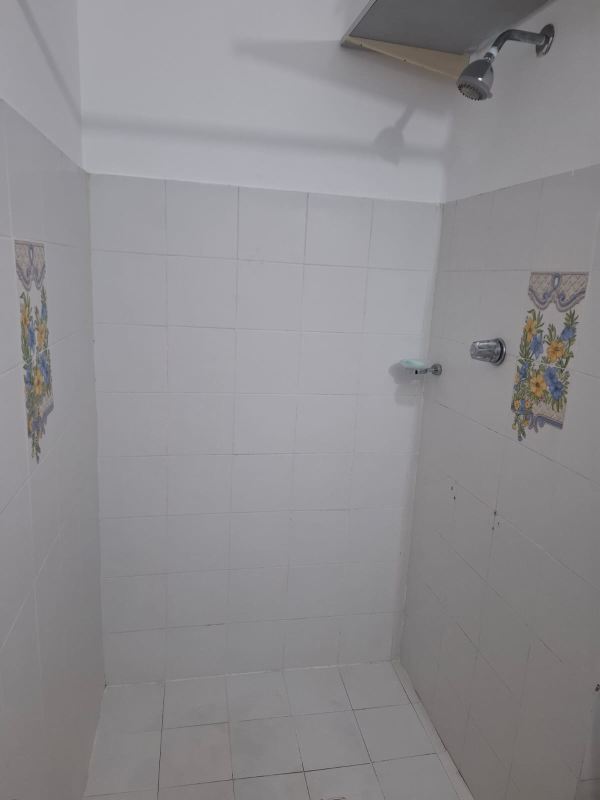 Tiled walk-in shower bathroom with accent tiles PH Campo Limberg Panama City