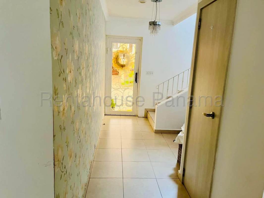 Bright hallway floral wallpaper tile floor staircase Villa Tivoli Brisas del Golf