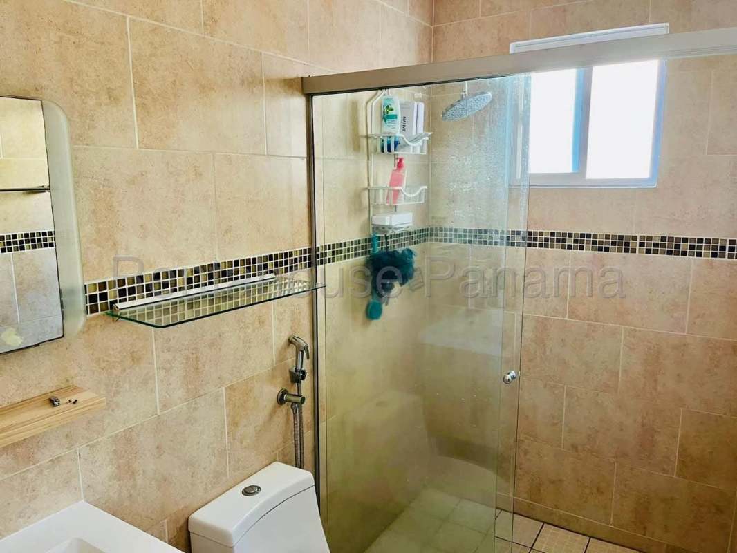 Bathroom with beige tiles, glass shower enclosure, rain shower Villa Tivoli Brisas del Golf