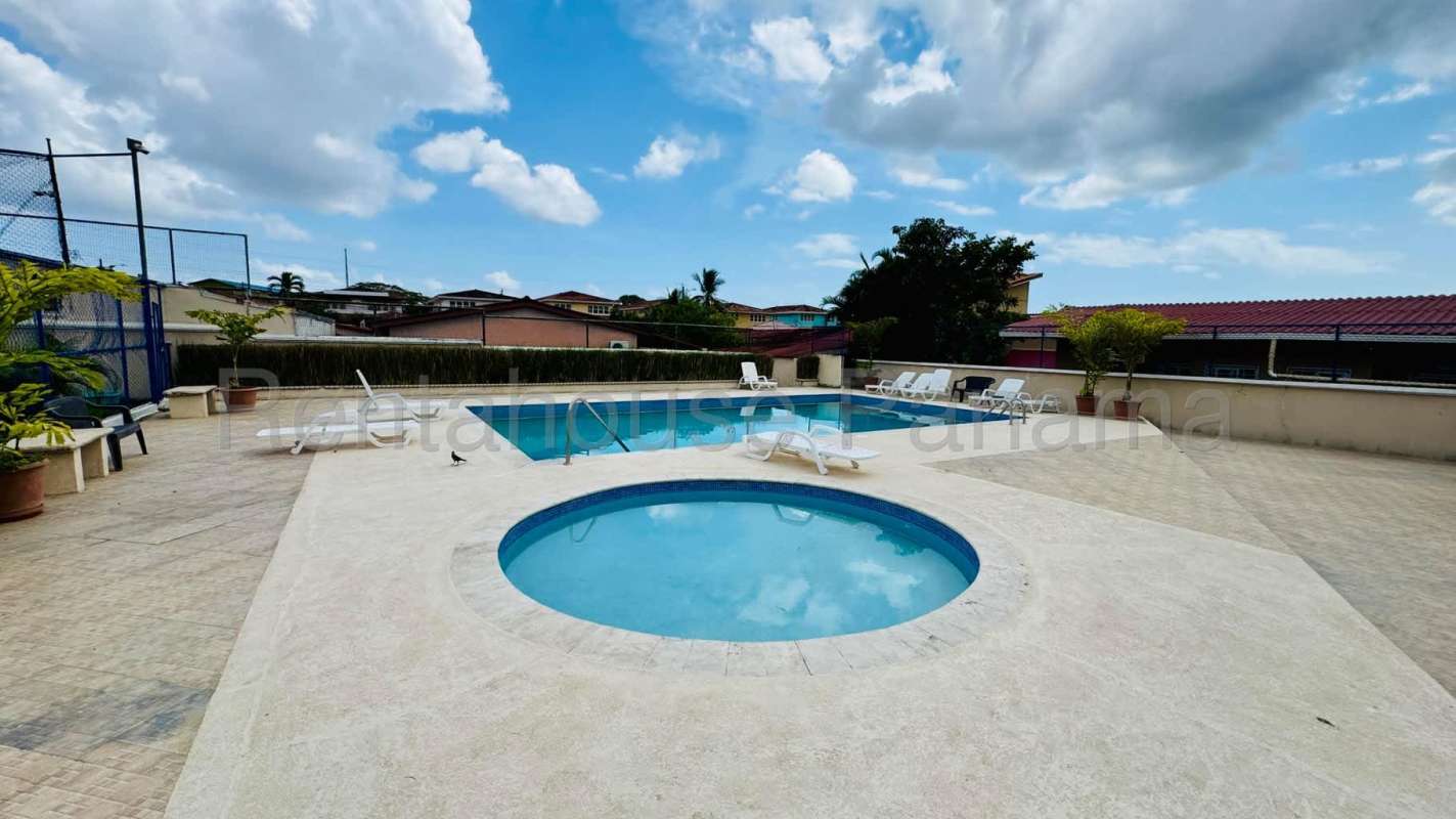 Swimming pool area with sun loungers, kiddie pool, and sport court in Quintas Monticello Panama