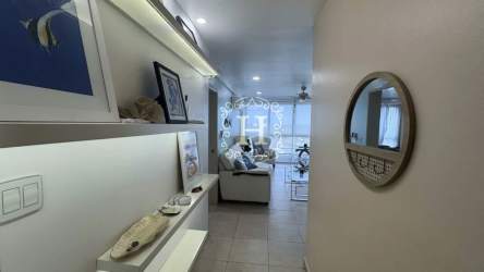 Hallway with decorative shelves and coastal decor at Coronado Bay condo Panama