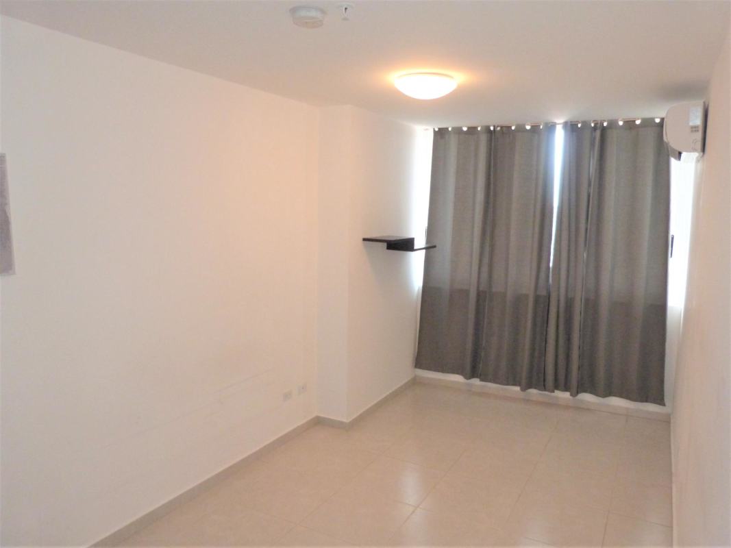 Bedroom with closet and large windows with ocean view at PH Bay View Panama