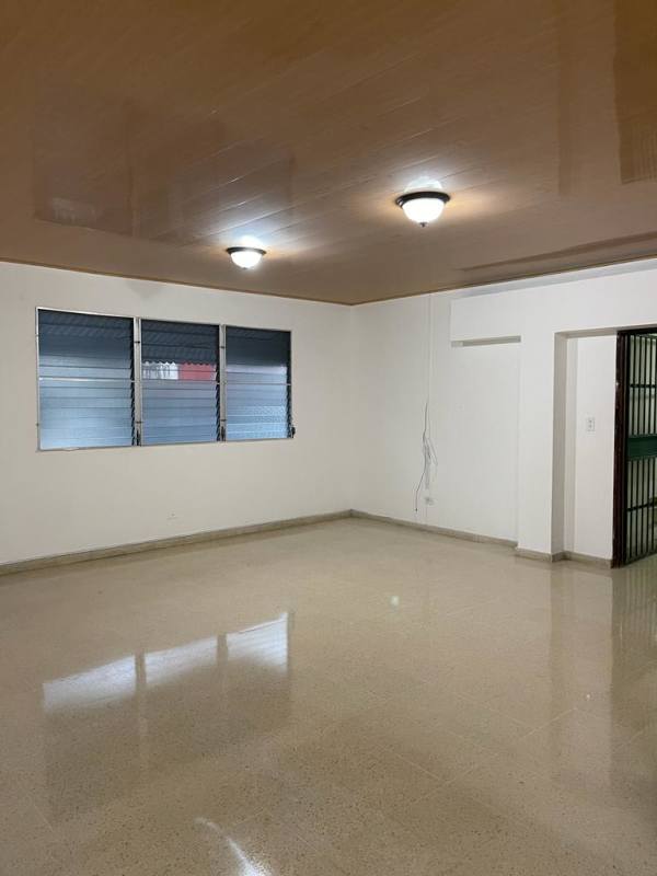 Open living area with polished tiles, brown ceiling and window in Betania PH Castro apartment rent Panama City