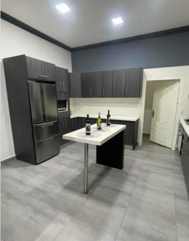 Modern kitchen with granite island, stainless appliances in Vista Magna Condominium Panama
