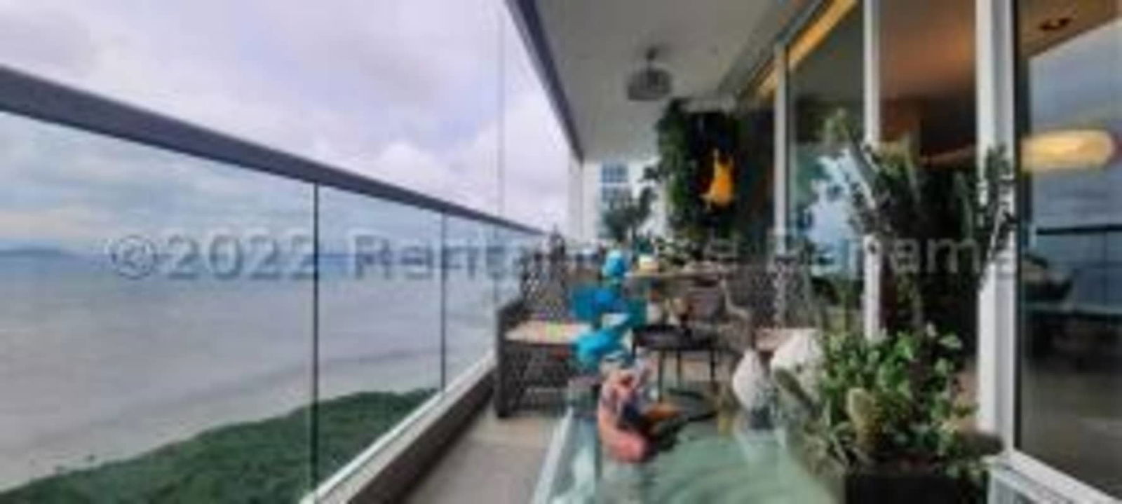 Master bedroom suite with oceanfront view and walk-in closet at PH Acqua Panama City