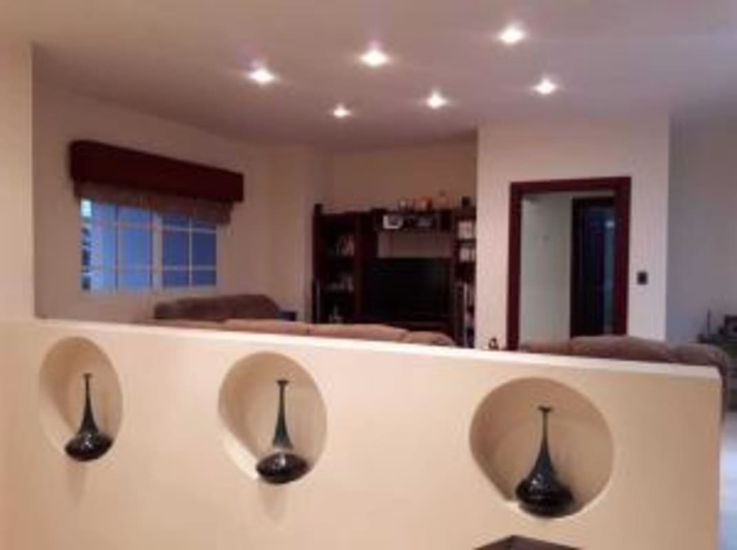 Spacious living room with modern decor, recessed lighting in Costa de las Perlas Panama