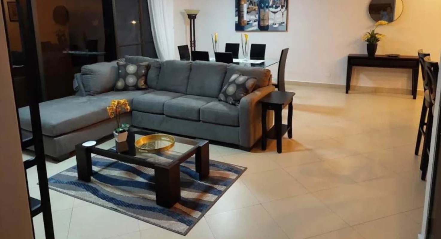 Open plan living and dining furnished apartment with balcony in Embassy Club Clayton Panama