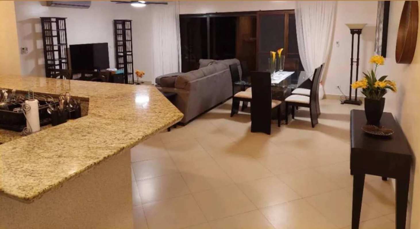 Contemporary open kitchen, dining and living area furnished Embassy Club Clayton Panama